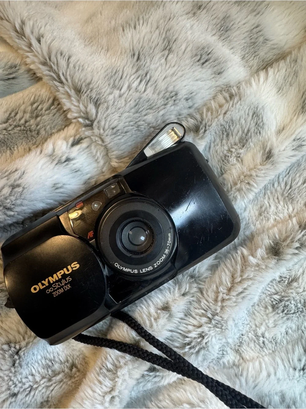 Olympus compact film camera in black with built-in flash